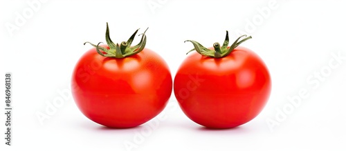 A pair of red ripe tomatoes...