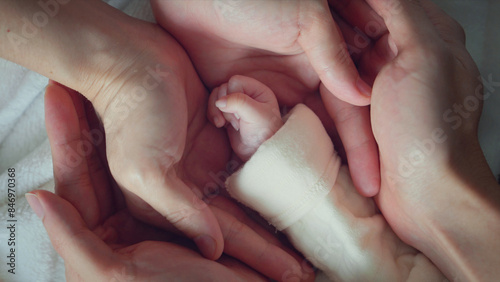 Bild auf Leinwand Father and mother hold in their hands a little newborn baby, New life, Happiness