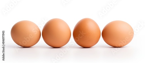 Three eggs are lined up in ...