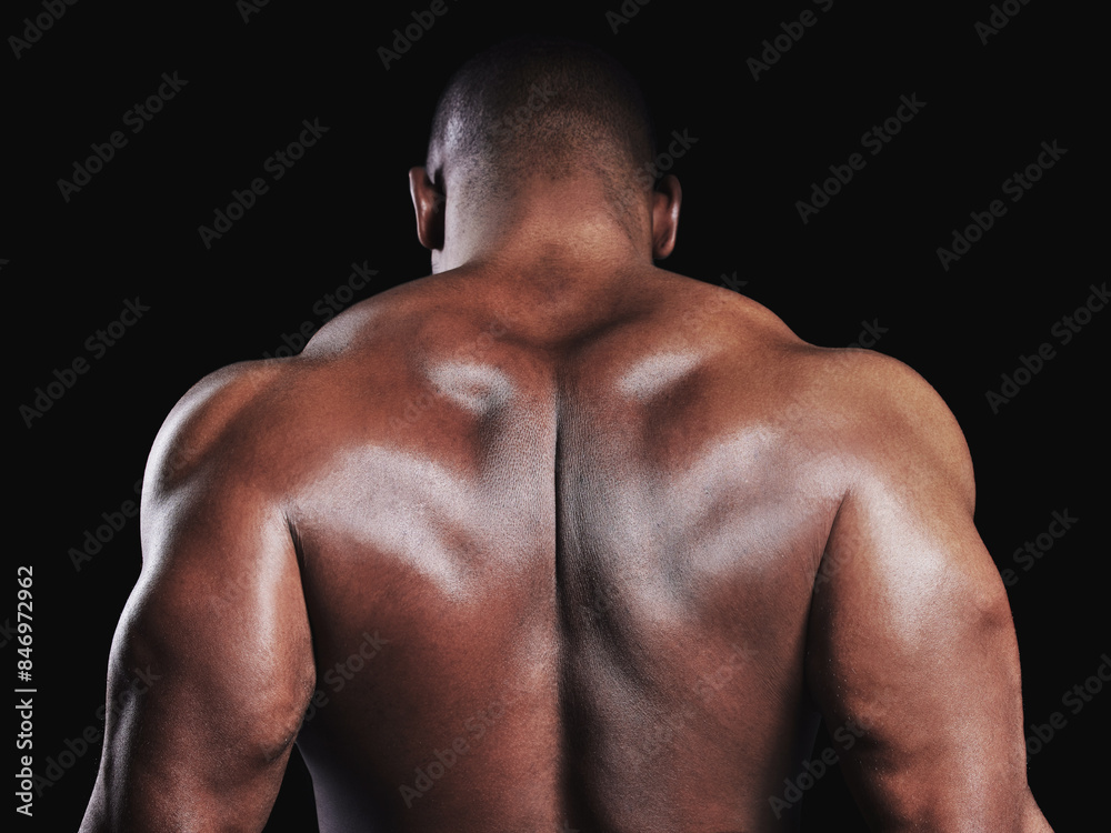 African man, back and flexing muscle for exercise with health, workout goals and sports training in studio. Male person, bodybuilder and progress results with skin and strong body by black background African man, back and flexing muscle for exercise with health, workout goals and sports training in studio. Male person, bodybuilder and progress results with skin and strong body by black background
