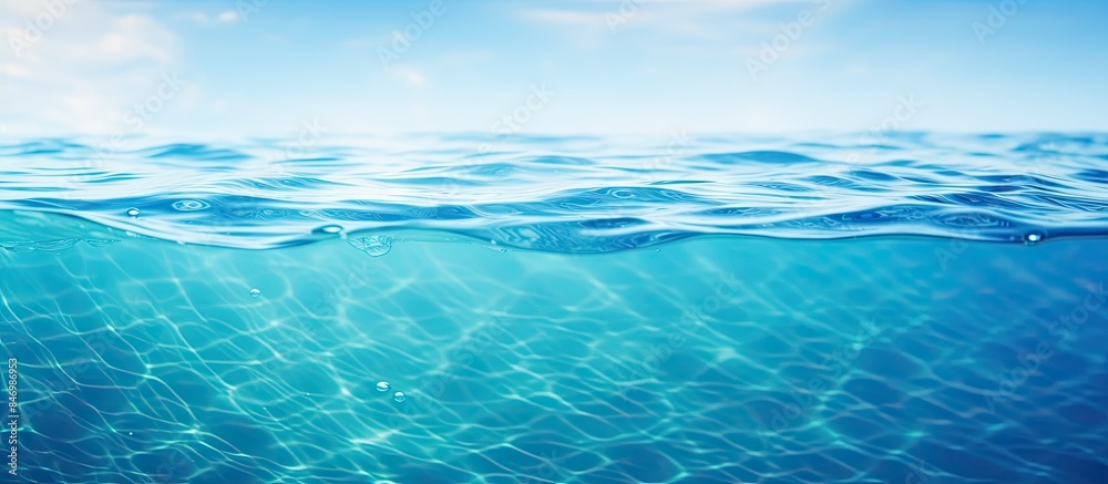 Blue ocean water bubbles in a close-up shot, with a smooth natural background and abstract bokeh effects, creating a vintage and soft colored blur on the sea or ocean surface. with copy space image Blue ocean water bubbles in a close-up shot, with a smooth natural background and abstract bokeh effects, creating a vintage and soft colored blur on the sea or ocean surface. with copy space image