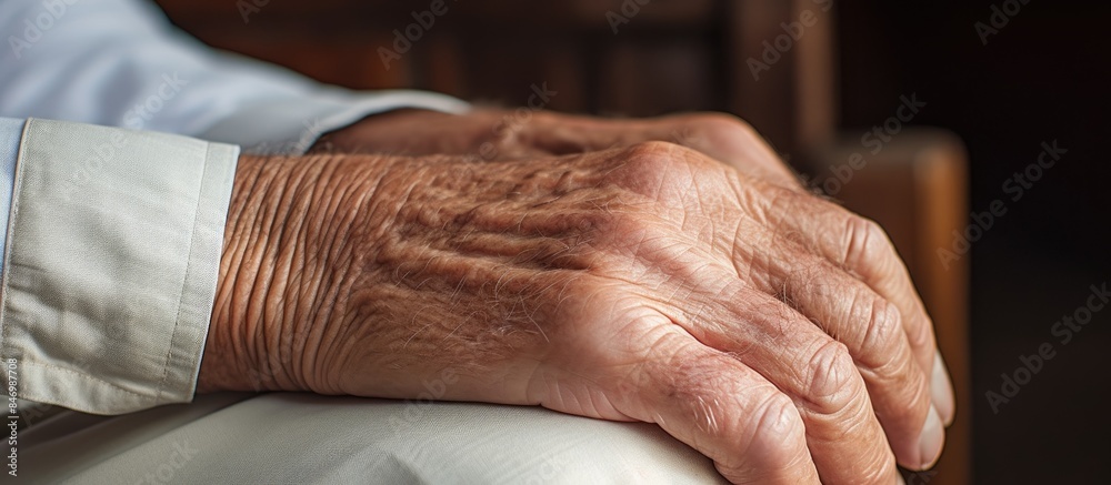 Fototapeta premium Elderly individuals in a nursing home engaging in solving a jigsaw puzzle together using their experienced hands. with copy space image. Place for adding text or design