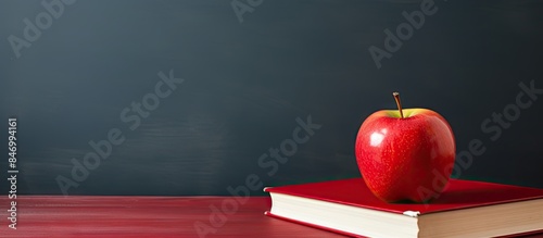Red apple positioned on top...