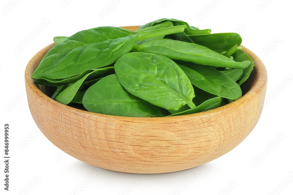 Baby spinach leaves in wooden bowl isolated on white background Baby spinach leaves in wooden bowl isolated on white background
