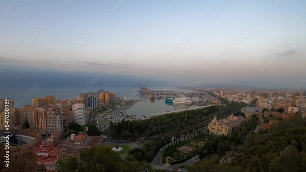 Panoramic aerial view of Malaga in a cloudy summer day in the morning in Malaga, Spain Panoramic aerial view of Malaga in a cloudy summer day in the morning in Malaga, Spain