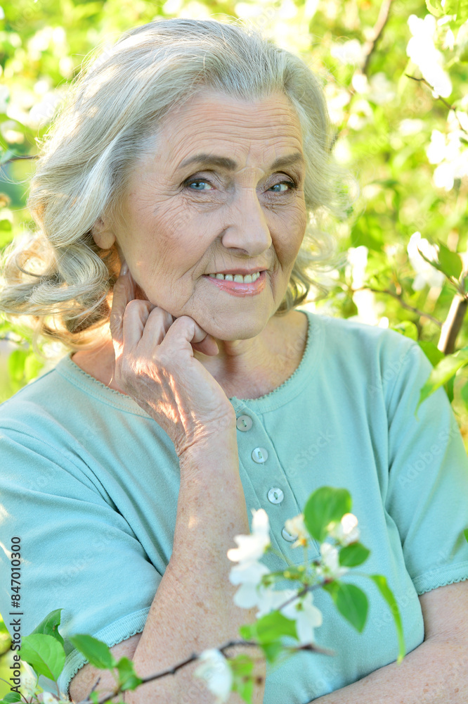 Portrait of a beautiful woman in the park in summer Portrait of a beautiful woman in the park in summer