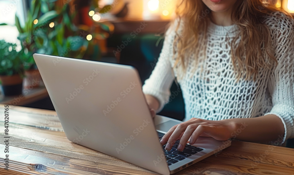 Casual Female Freelancer Working Remotely on Laptop at Cafe Table - Business, Freelance Lifestyle Casual Female Freelancer Working Remotely on Laptop at Cafe Table - Business, Freelance Lifestyle