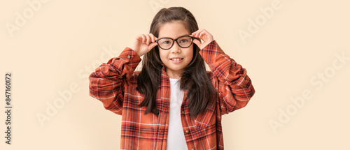 Funny little girl with glas...