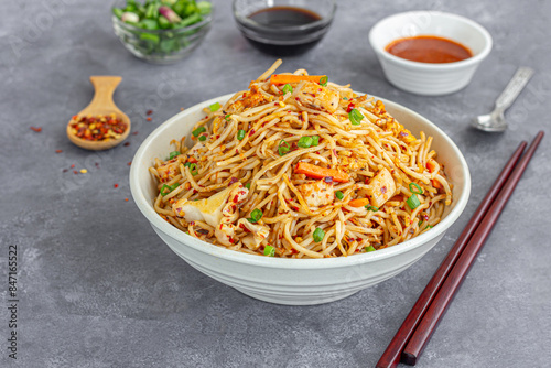 Chicken Chow Mein, Chicken Noodles Garnished with Scallion Served with Condiments, Popular Chinese Take Out Photography photo