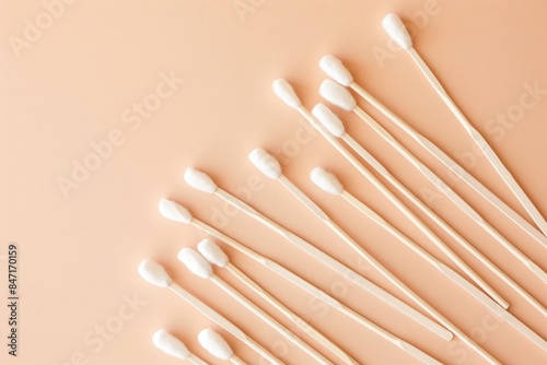 Minimal composition of cotton swabs on beige background, flat lay with copy space. Landscape top view stock photo contest winner, photo
