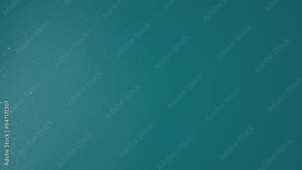 Aerial View of Turquoise Waters Surrounded by Verdant Greenery and Tranquil Nature Aerial View of Turquoise Waters Surrounded by Verdant Greenery and Tranquil Nature