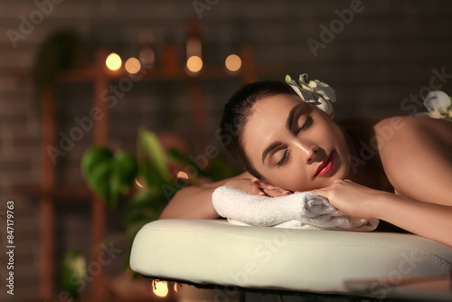 Young woman relaxing in dar...