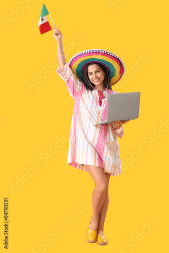 Young woman in sombrero hat...