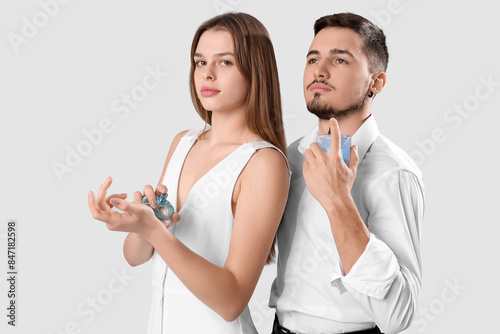Young couple with bottles o...