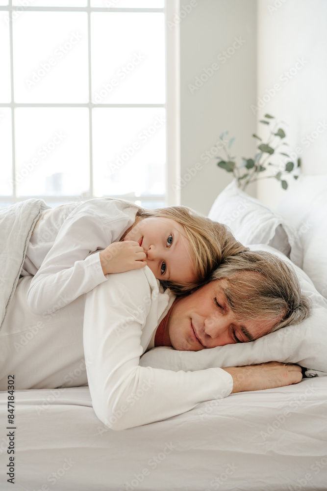 Father and daughter lying in bed Father and daughter lying in bed