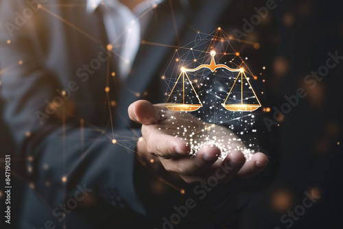 A Symbolic Representation of Justice and Law as a Man's Hand Holds a Law Icon in the Background, Blending Modern Technology with Legal Principles photo