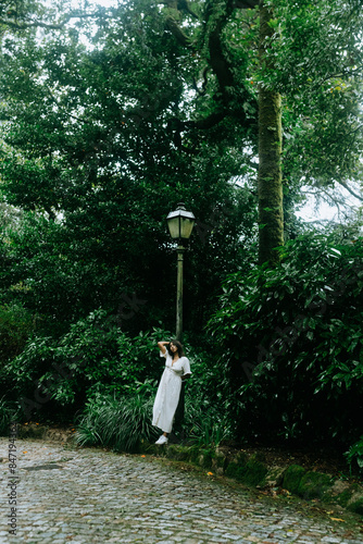 Woman Exploring Foggy Sintra Forest photo