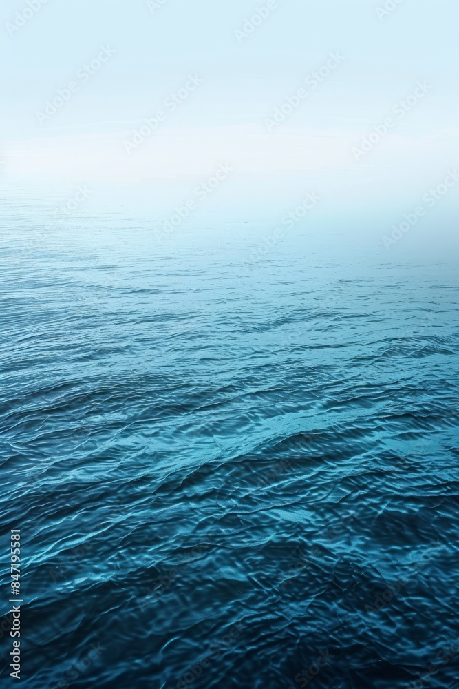 Fototapeta premium Tranquil Blue Ocean Waters on a Foggy Morning