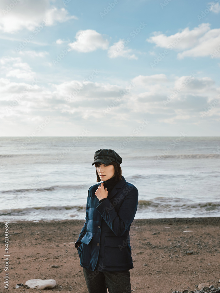 Woman standing in front of the ocean view Woman standing in front of the ocean view