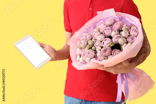 Male courier with tablet co...