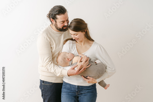 young parents with baby in studio 