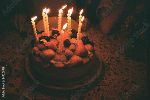 A cake with candles at night photo