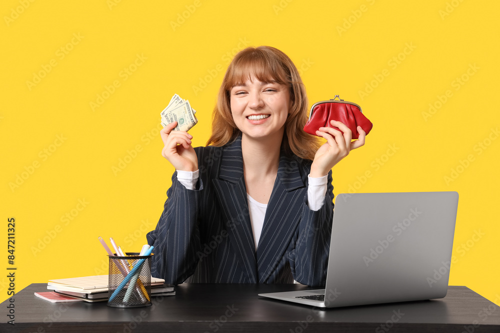 Beautiful young woman holding red purse and money on yellow background Beautiful young woman holding red purse and money on yellow background