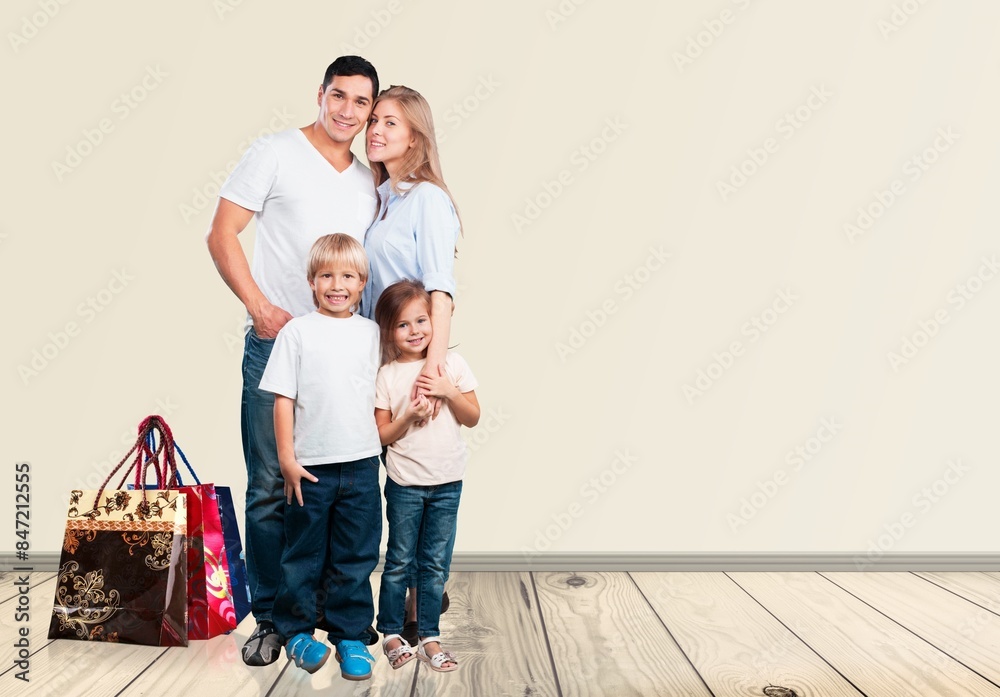 young parents with children and shopping bags young parents with children and shopping bags