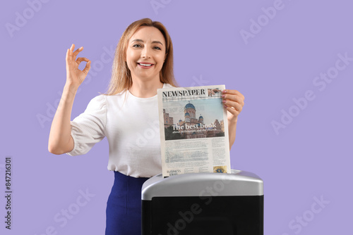 Adult woman destroying news...