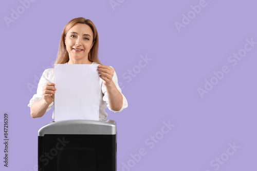 Adult woman destroying pape...