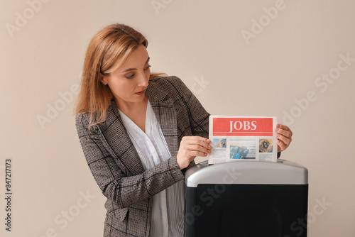 Adult woman destroying news...