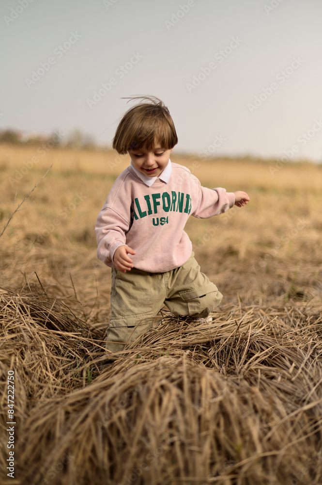 happy boy running in a green field happy boy running in a green field
