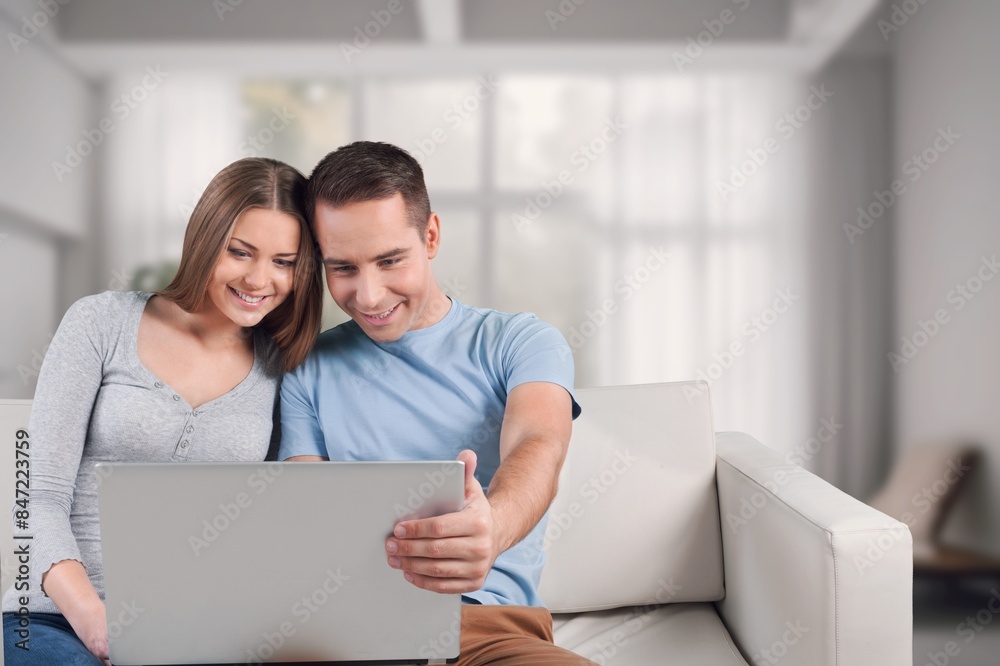 Happy young couple with digital gadget Happy young couple with digital gadget
