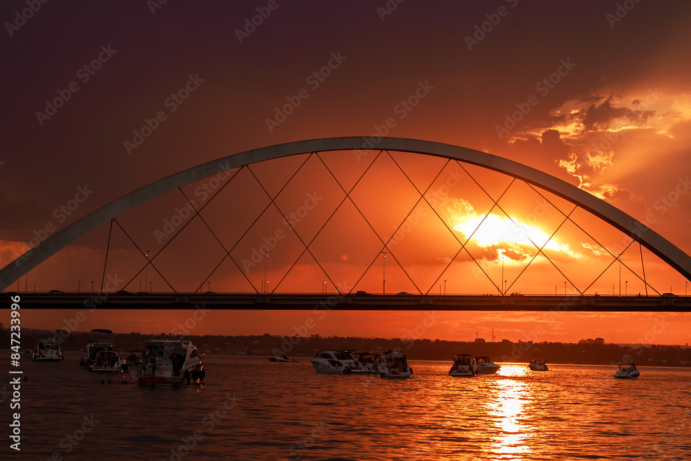 Naklejka premium Sunset over the Paranoa Lake with rain in the background