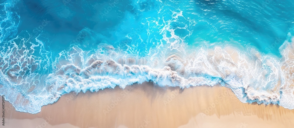 Peaceful beach scene captured from above with calming waves, stunning blue ocean, and sunlit coastline. Ideal banner for summer vacation getaways. Peaceful beach scene captured from above with calming waves, stunning blue ocean, and sunlit coastline. Ideal banner for summer vacation getaways.