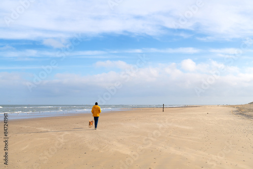 Walking the dog at the beach