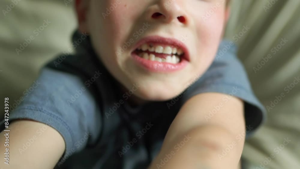 Closeup portrait of a smiling 6-year-old boy in a bed Closeup portrait of a smiling 6-year-old boy in a bed