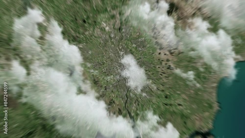 Zooming on Glasgow, Scotland. Earth zoom in from outer space to city. The animation continues by zoom out through clouds and atmosphere into space. View of the Earth at night. Images from NASA. 4K