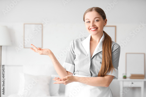 Pretty chambermaid showing ...