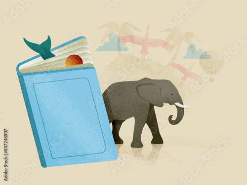 Gray cartoon elephant coming out of blue book photo
