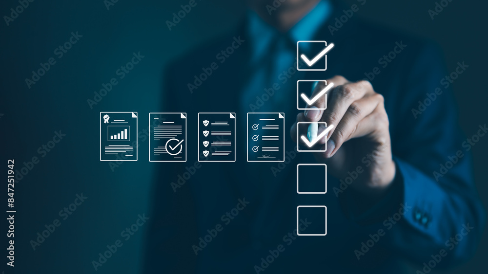 © Supatman - Quality Assurance and Document Control with Checklist Icons. Businessman mark off items on digital checklist, representing quality assurance and document control processes, verification and compliance