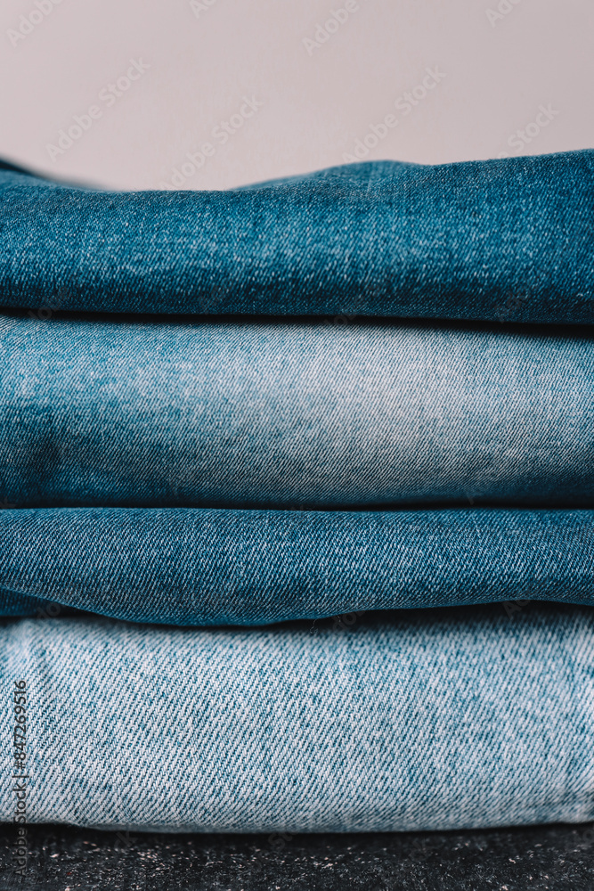 Stack of Various Shades Of Blue Jeans On White Background Denim jeans texture Stack of Various Shades Of Blue Jeans On White Background Denim jeans texture