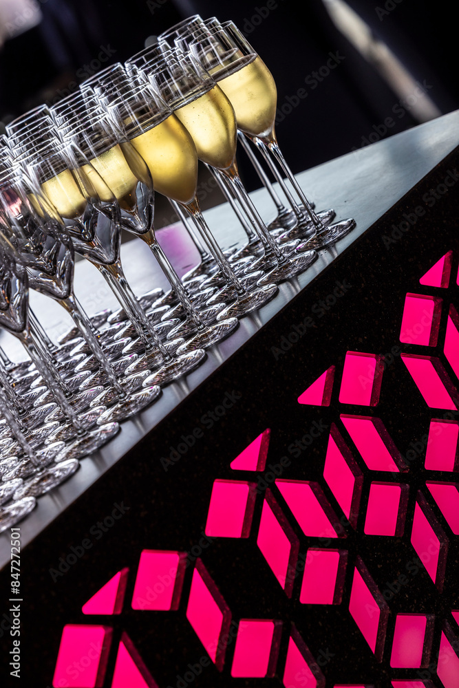 Champagne glasses on a bar