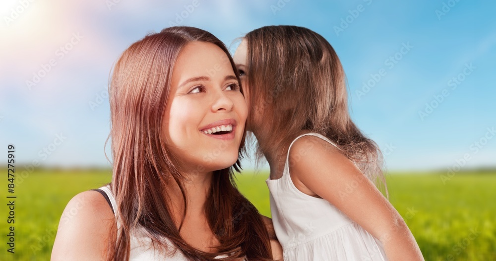 Tender scene of child with mom at nature background Tender scene of child with mom at nature background