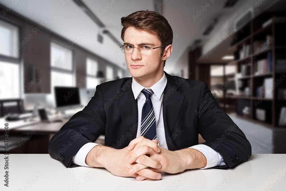 Portrait of a young banker at workplace office Portrait of a young banker at workplace office
