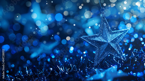 Celebrate the holidays with a shimmering blue star ornament hanging