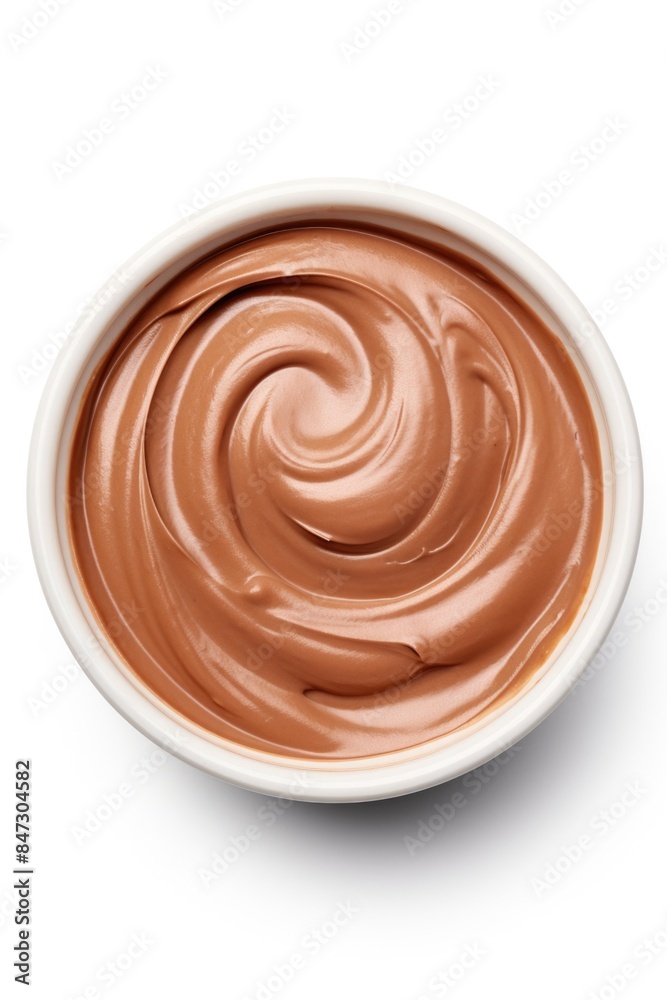 Rich and creamy chocolate pudding served on a clean white surface, ideal for dessert or snack Rich and creamy chocolate pudding served on a clean white surface, ideal for dessert or snack