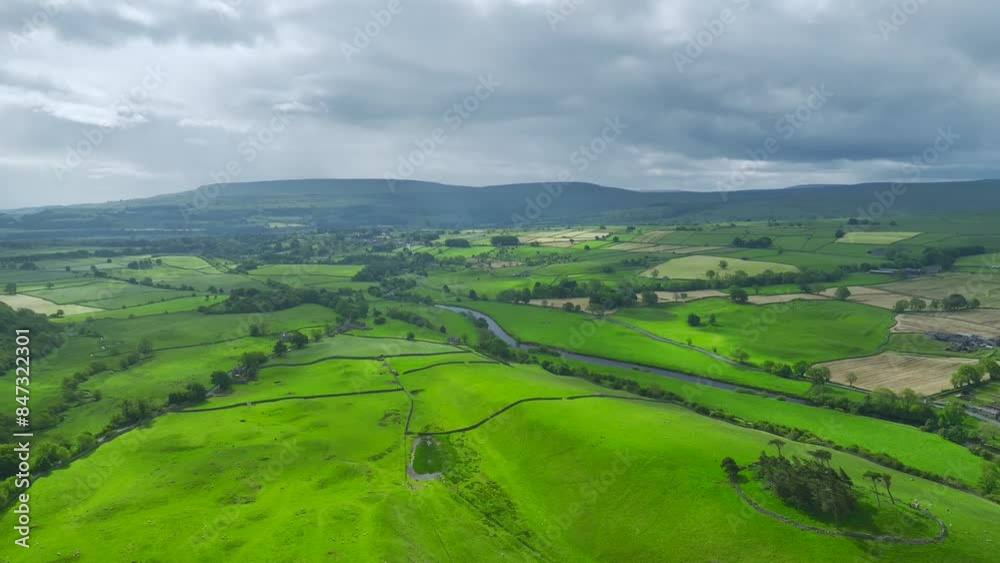 Farms and Fields over Bainbridge Village from a drone, Leyburn, North Yorkshire, England
