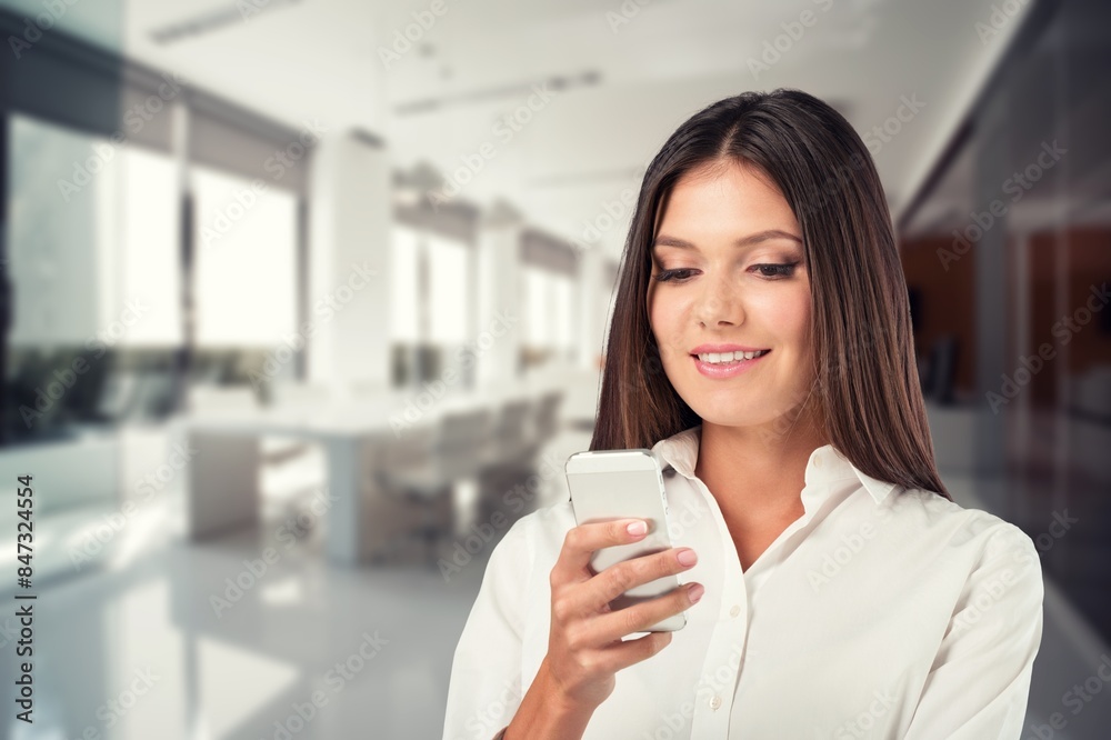 A young woman at work in office building A young woman at work in office building