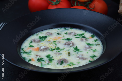 Meatball soup with carrot and potatoes named ekşili terbiyeli sulu köfte or eksili kofte